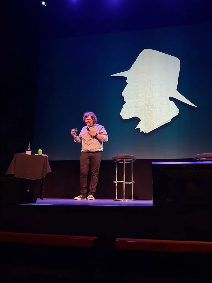 Marc Burrows raises a glass of Brandy in honour of Terry Pratchett