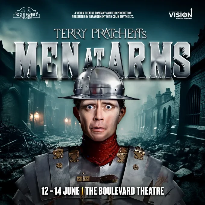 Men at Arms Poster Production poster showing a worried looking watchman standing in the middle of a dark road with the words Terry Pratchett's Men at Arms across the middle