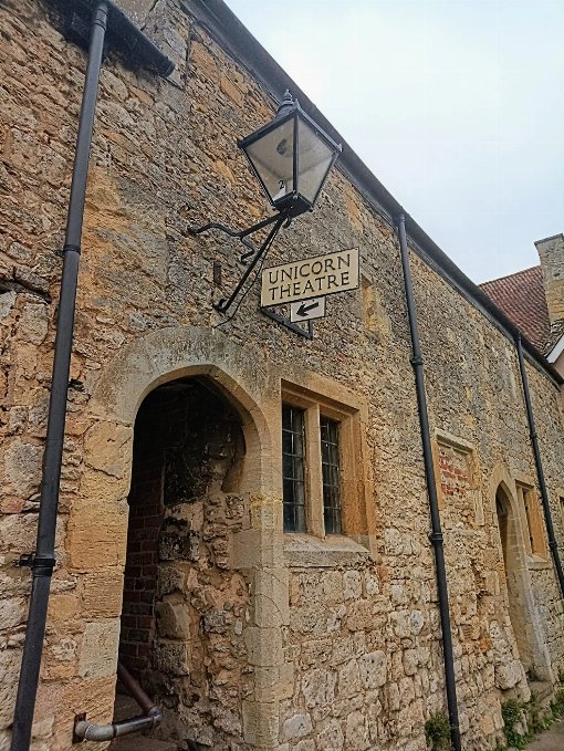 Picture of passage way entrance to the Unicorn Theatre - with sign that says Unicorn Theatre