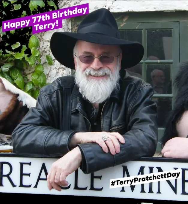 Happy 77th Birthday Terry Pratchett Photo of Terry Pratchett leaning on a street name post based on one of his street in Ankh-Morpork